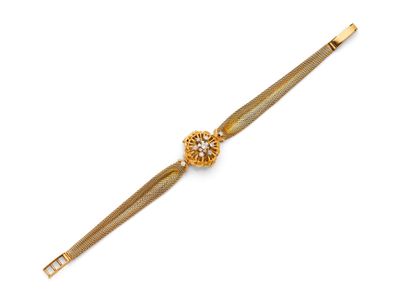an 18k yellow gold bracelet with a flower clasp