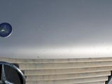 a close up of a mercedes emblem on a car