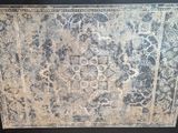 an image of a picture of a rug on display in a room