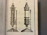 a book with a drawing of a tower and a clock on it