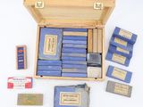 a wooden box filled with different types of cigarettes