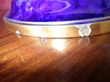 a close up of a purple cake on a wooden table