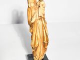 statue of an angel holding a child on a marble base