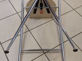 a picture of a kitchen floor with a metal stand on it