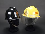 pair of yellow and black hard hats sitting on top of a black mannequin head