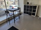 an image of a dining room with a view of the street