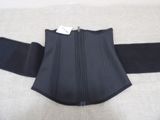 the back of a black corset with a zipper on it
