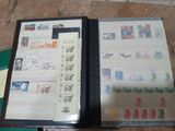an open book with stamps on it sitting on a table