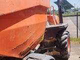 a tractor that is parked on the side of the road