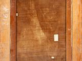 an old wooden frame with a picture of a cat on it