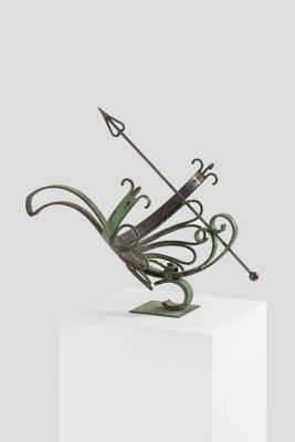 an image of a sculpture of a butterfly with a bow on top of it