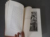a person holding an open book with a picture on it