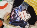 a box full of clothes that is sitting on the floor