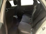the back seat of a car with a suitcase in the back
