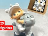 a small figurine of a baby riding a toy horse