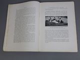 an open book with a picture of a group of people on it