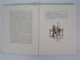 an open book with a picture of a person sitting at a table