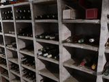 many bottles of wine on the shelves in the room
