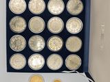 a lot of coins in a box on the table