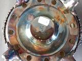a close up of a metal object with holes in it
