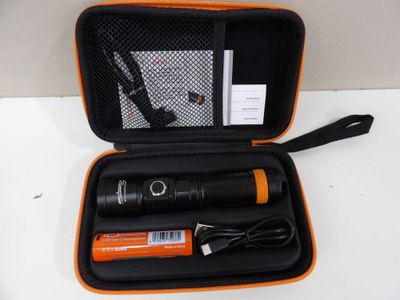 an orange case holding a flashlight and a charger