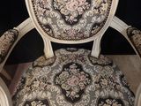 an image of a chair with a floral upholstered back