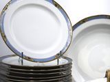 many plates stacked on top of each other on a table