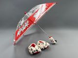 a dalmatian umbrella and two dalmatian slippers on the floor