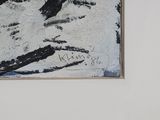 a black and white painting on the wall of a room