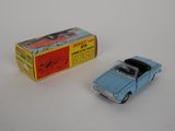 a blue toy car and a box on a white surface