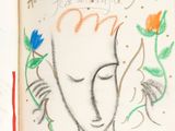 un livre sur lequel figure le dessin d'une femme et de fleurs
