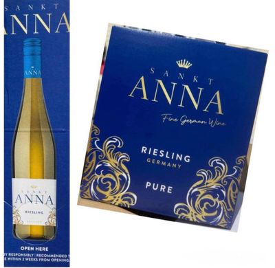 un gros plan sur une bouteille de vin à côté d'une boîte de vin