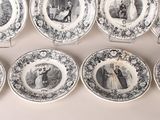 several plates with black and white pictures of people on them