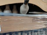 many bottles of wine that are wrapped in plastic