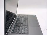 two open laptops sitting side by side on a white surface