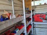 many bins of tools in the back of a truck