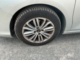 a close up of a car ' s tire on the road