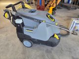 an image of a high pressure washer in a garage