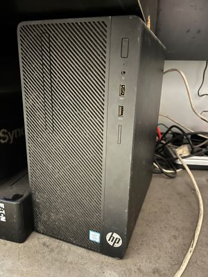a small black desktop computer sitting on a table