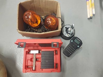 a box of orange lights sitting on a table next to a calculator