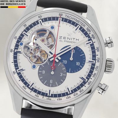 a close up of a wrist watch with a blue face
