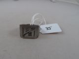 a silver ring with a no smoking sign on it