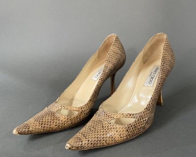 an image of a pair of women ' s shoes on a gray surface