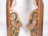 two figurines that are standing next to each other