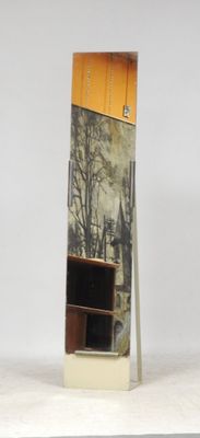 a tall mirror with a picture on it in the middle of a room