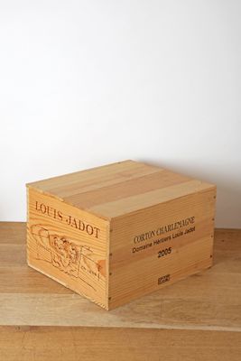 a wooden box with a label on it sitting on a table