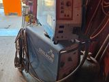 a machine that is sitting on a cart in a garage
