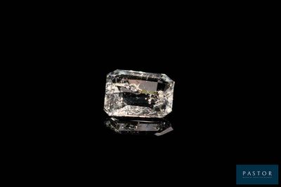 an uncut diamond on a black background