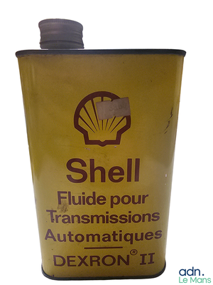 a can of shell fluid on a white background