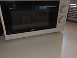 a microwave sitting on top of a counter in a kitchen